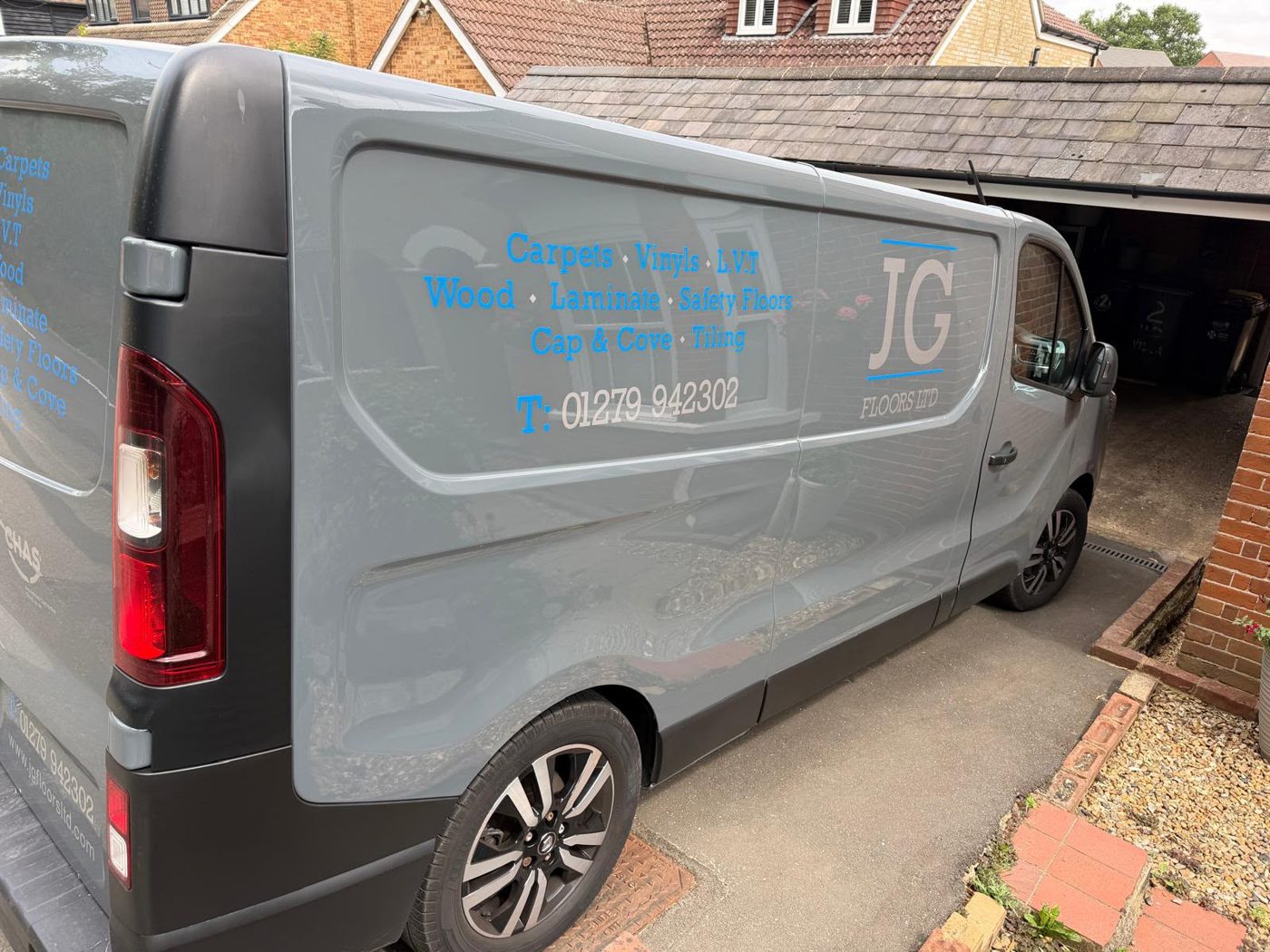The old grey Renault van with blue JG Floors lettering on the side