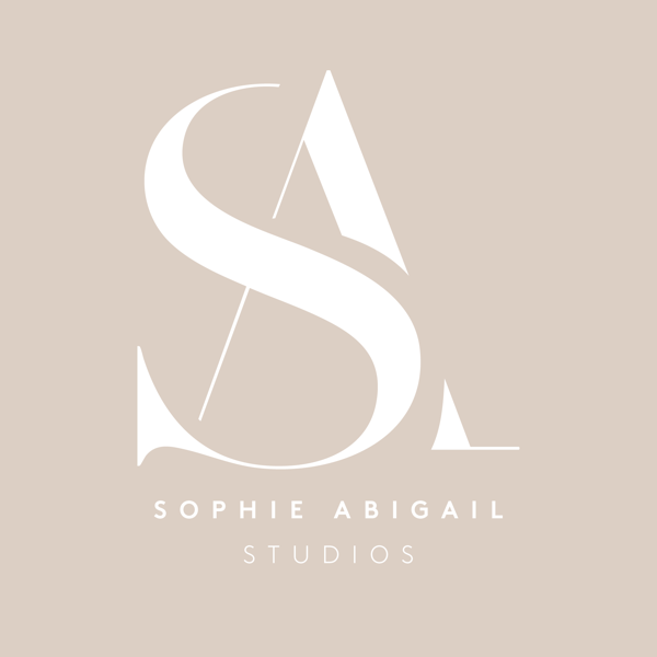 Monogram in white on the sand brand colour